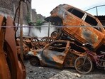 Damaged vehicles which were set fire during the Delhi riots seen dumped inside a parking lot six months after the North-East Delhi riots, at Shiv Vihar, in New Delhi 