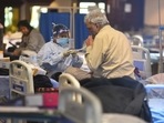 A patient being attended by a healthcare worker in Delhi Covid-19 care facility.(Raj K Raj/HT File) A patient being attended by a healthcare worker in Delhi Covid-19 care facility.(Raj K Raj/HT File)