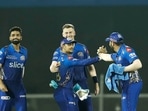 Mumbai: Mumbai Indians players celebrate the wicket of Rahul Tewatia of Gujarat Titans during the 51st T20 cricket match of the Indian Premier League 2022 (IPL season 15), between the Gujarat Titans and the Mumbai Indians, at Brabourne Stadium (CCI) in Mumbai, Friday, May 6, 2022. (Sportzpics for IPL/PTI Photo) (PTI05_06_2022_000251B)(PTI)