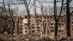 Trees and apartments are damaged by the impact of a missile explosion in Kramatorsk, eastern Ukraine.