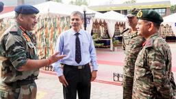 Northern Command chief Lt Gen Upendra Dwivedi arrives at Dhruva Auditorium in Jammu district on Friday. (PTI)