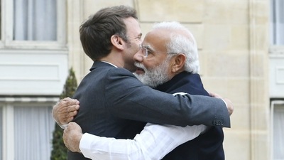 Prime Minister Narendra Modi hugs French president Emmanuel Macron in Paris. (Twitter/Narendra Modi) Prime Minister Narendra Modi hugs French president Emmanuel Macron in Paris. (Twitter/Narendra Modi)