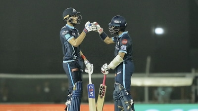 Mumbai: Wriddhiman Saha and Shubman Gill of Gujarat Titans greet each other during the 51st T20 cricket match of the Indian Premier League 2022 (IPL season 15), between the Gujarat Titans and the Mumbai Indians, at Brabourne Stadium (CCI) in Mumbai, Friday, May 6, 2022. (Sportzpics for IPL/PTI Photo) (PTI05_06_2022_000230B) (PTI)