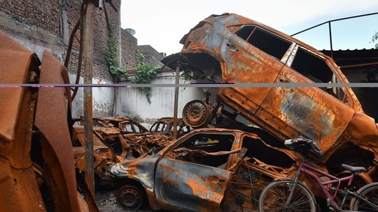 Damaged vehicles which were set fire during the Delhi riots seen dumped inside a parking lot six months after the North-East Delhi riots, at Shiv Vihar, in New Delhi&nbsp;
