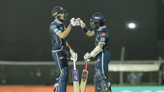 Mumbai: Wriddhiman Saha and Shubman Gill of Gujarat Titans greet each other during the 51st T20 cricket match of the Indian Premier League 2022 (IPL season 15), between the Gujarat Titans and the Mumbai Indians, at Brabourne Stadium (CCI) in Mumbai, Friday, May 6, 2022. (Sportzpics for IPL/PTI Photo) (PTI05_06_2022_000230B)(PTI)
