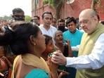 Union home minister Amit Shah meets with family members of deceased youth wing leader Arjun Chowrasia, in Kashipur on May 6, 2022. (ANI Photo) Union home minister Amit Shah meets with family members of deceased youth wing leader Arjun Chowrasia, in Kashipur on May 6, 2022. (ANI Photo)