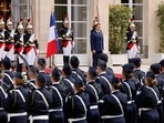 Emmanuel Macron (C) reviews troops at the Elysee presidential palace in Paris. Emmanuel Macron (C) reviews troops at the Elysee presidential palace in Paris.