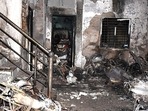 Charred remains are pictured after a massive fire broke out in a building, at Swarna Bagh Colony, in Indore on May 7, 2022. (ANI) Charred remains are pictured after a massive fire broke out in a building, at Swarna Bagh Colony, in Indore on May 7, 2022. (ANI)