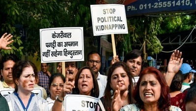 BJP workers hold banners against Delhi chief minister Arvind Kejriwal. (Twitter/ANI) BJP workers hold banners against Delhi chief minister Arvind Kejriwal. (Twitter/ANI)