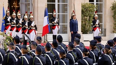 Emmanuel Macron (C) reviews troops at the Elysee presidential palace in Paris. (AFP) Emmanuel Macron (C) reviews troops at the Elysee presidential palace in Paris. (AFP)
