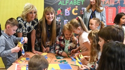 First Lady Jill Biden, left, speaks to children during her visit to the Uruguay School, in Bucharest Romania. The first ladies of the United States and Romania met with children and the educators who are helping teach displaced Ukrainian children. (AP)