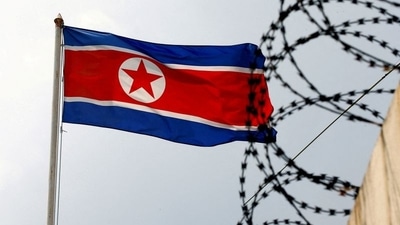 FILE PHOTO: A North Korea flag flutters next to concertina wire at the North Korean embassy (REUTERS/File Photo)