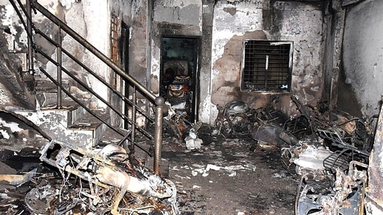 Charred remains are pictured after a massive fire broke out in a building, at Swarna Bagh Colony, in Indore on Saturday.(ANI)