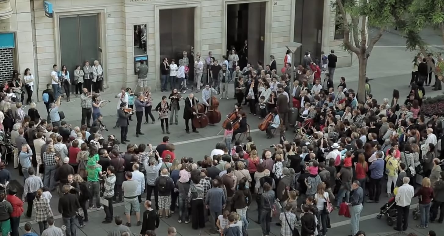 An orchestral flash mob performs the symphony at Placa de Sant Roc in Sabadell, Spain. An orchestral flash mob performs the symphony at Placa de Sant Roc in Sabadell, Spain.