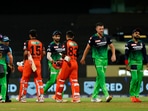 Royal Challengers Bangalore and Sunrisers Hyderabad players greet each other after the end of their Indian Premier League 2022 cricket match, at the Wankhede Stadium(PTI)