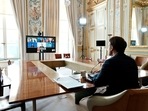 French President Emmanuel Macron takes part in a video-conference of G7 leaders, amid Russia's invasion of Ukraine, at the Elysee Palace in Paris, France, May 8, 2022. (Thibault Camus/Pool via REUTERS)