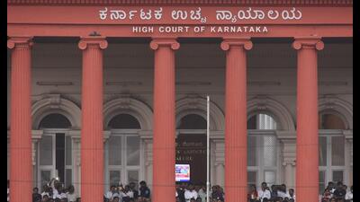 Bengaluru, India - May 23, 2018: Karnataka High Court staffs watching the swearing-in ceremony of the new Chief Minister of Karnataka Kumarswamy as the 24th Chief Minister of Karnataka from the High Court balcony in Bengaluru, India, on Wednesday, May 23, 2018. (Photo by Arijit Sen/Hindustan Times) (Arijit Sen/HT Photo) Bengaluru, India - May 23, 2018: Karnataka High Court staffs watching the swearing-in ceremony of the new Chief Minister of Karnataka Kumarswamy as the 24th Chief Minister of Karnataka from the High Court balcony in Bengaluru, India, on Wednesday, May 23, 2018. (Photo by Arijit Sen/Hindustan Times) (Arijit Sen/HT Photo)
