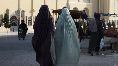 Burqa-clad women walk along a street in Kandahar. (AFP) Burqa-clad women walk along a street in Kandahar. (AFP)