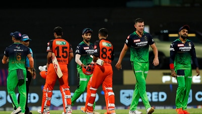 Royal Challengers Bangalore and Sunrisers Hyderabad players greet each other after the end of their Indian Premier League 2022 cricket match, at the Wankhede Stadium (PTI) Royal Challengers Bangalore and Sunrisers Hyderabad players greet each other after the end of their Indian Premier League 2022 cricket match, at the Wankhede Stadium (PTI)
