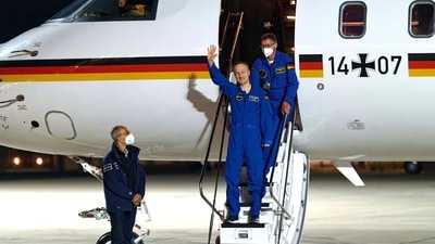 Astronaut Matthias Maurer steps off the plane after arriving at Cologne/Bonn Airport, in Cologne, Germany. The 52-year-old astronaut from the German state of Saarland had spent around six months aboard the International Space Station ISS. SpaceX brought four astronauts home, including Maurer, and three U.S. astronauts, with a midnight splashdown in the Gulf of Mexico on Friday. (AP) Astronaut Matthias Maurer steps off the plane after arriving at Cologne/Bonn Airport, in Cologne, Germany. The 52-year-old astronaut from the German state of Saarland had spent around six months aboard the International Space Station ISS. SpaceX brought four astronauts home, including Maurer, and three U.S. astronauts, with a midnight splashdown in the Gulf of Mexico on Friday. (AP)