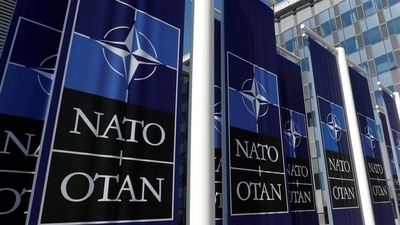 FILE PHOTO: Banners displaying the NATO logo are placed at the entrance of new NATO headquarters during the move to the new building, in Brussels, Belgium April 19, 2018.  REUTERS/Yves Herman/File Photo (REUTERS)