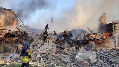 Ukrainian firefighters putting out a fire after Russian missiles hit a school in eastern Ukraine's Lugansk region on Saturday. (AFP)