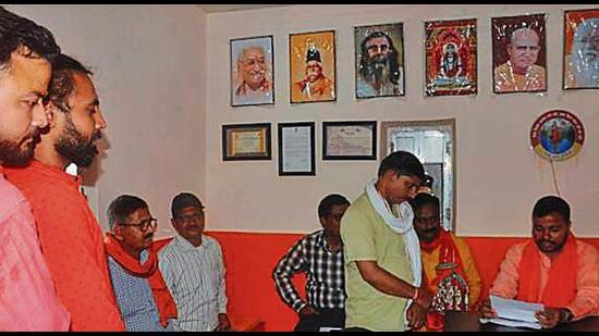 People at Hindu Yuva Vahini office at the Gorakhnath Math in the crowded Maidagin area of Varanasi. (Rajesh Kumar/HT)