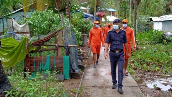 Cyclone Asani: NDRF and police personnel at low lying areas of fishermen village, ahead of the landfall of Cyclone Asani, in Andaman and Nicobar Islands. (PTI)