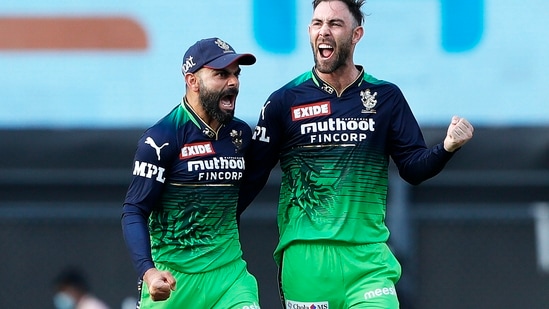 Virat Kohli and Glenn Maxwell of Royal Challengers Bangalore celebrate a wicket, during the Indian Premier League 2022 cricket match between Sunrisers Hyderabad and Royal Challengers Bangalore(PTI)