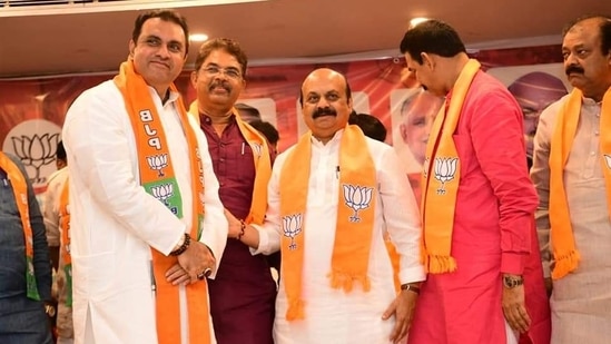 Pramod Madhwaraj joins the BJP along with other party leaders in the presence of Karnataka chief minister Basavaraj Bommai.