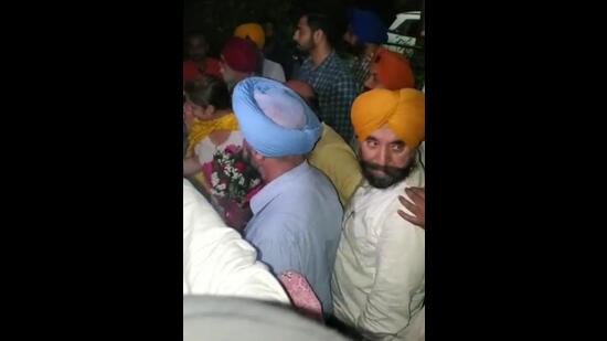 After his release, SAD leader Harpreet Bedi’s family and his supporters welcomed him with garlands when he reached Ludhiana’s BRS Nagar. (HT Photo)