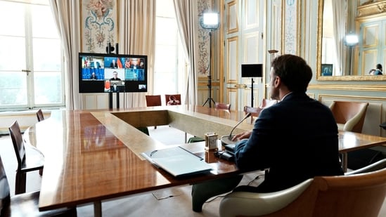 French President Emmanuel Macron takes part in a video-conference of G7 leaders, amid Russia's invasion of Ukraine, at the Elysee Palace in Paris, France, May 8, 2022. (Thibault Camus/Pool via REUTERS)