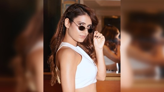 Fatima Sana Shaikh donned a white zip crop top which she teamed with a high-rise constellation polka dot pyjama.(Instagram/@fatimasanashaikh)