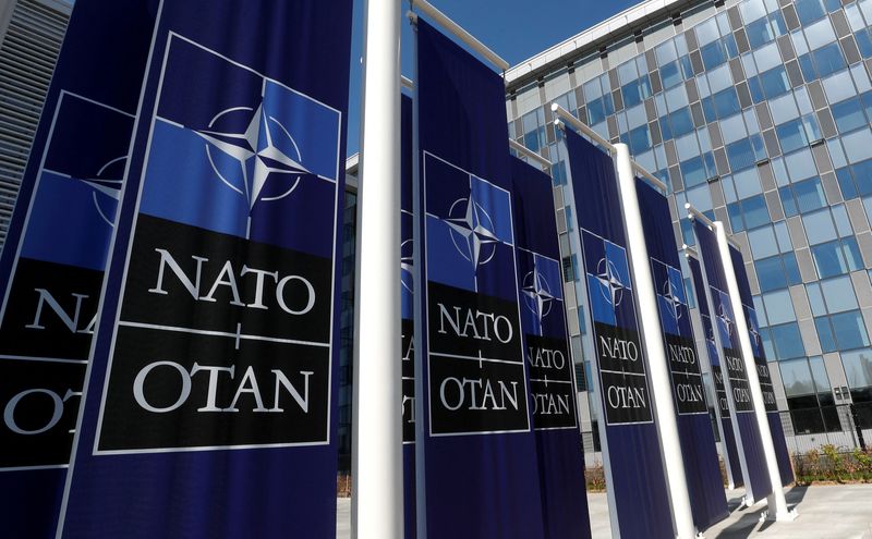 FILE PHOTO: Banners displaying the NATO logo are placed at the entrance of new NATO headquarters during the move to the new building, in Brussels, Belgium April 19, 2018.  REUTERS/Yves Herman/File Photo (REUTERS)