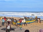 Fishermen park their boat on the shore after India Meteorological Department issued an alert for coastal states regarding Cyclone Asani, at Puri beach.(PTI) Fishermen park their boat on the shore after India Meteorological Department issued an alert for coastal states regarding Cyclone Asani, at Puri beach.(PTI)