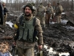 Servicemen of the Ukrainian Military Forces gather after the fighting against Russian troops and Russia-backed separatists near Zolote village, Luhansk region.