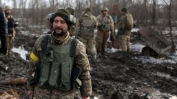 Servicemen of the Ukrainian Military Forces gather after the fighting against Russian troops and Russia-backed separatists near Zolote village, Luhansk region.