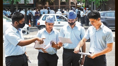 Class 10 students discussing the question paper after the ICSE physics exam outside St Stephen’s School in Sector 45, Chandigarh, on Monday. (Keshav Singh/HT)