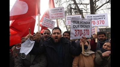 Activists of National Conference shout slogans and hold placards during a protest against the delimitation commission in Srinagar, Jammu and Kashmir, January 1, 2022. (Waseem Andrabi/Hindustan Times) Activists of National Conference shout slogans and hold placards during a protest against the delimitation commission in Srinagar, Jammu and Kashmir, January 1, 2022. (Waseem Andrabi/Hindustan Times)