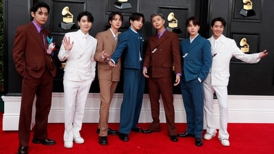 BTS pose on the red carpet as they attend the 64th Annual Grammy Awards. (REUTERS)