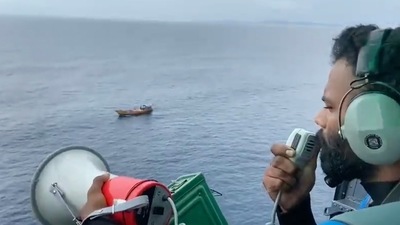 An Indian Coast Guard personnel announces warnings regarding cyclone Asani. (PTI) An Indian Coast Guard personnel announces warnings regarding cyclone Asani. (PTI)