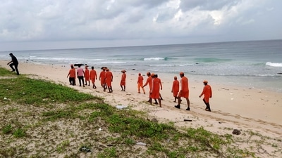 NDRF and police personnel at low lying areas of fishermen village, ahead of the landfall of Cyclone Asani, in Andaman and Nicobar Islands (PTI via NDRF)