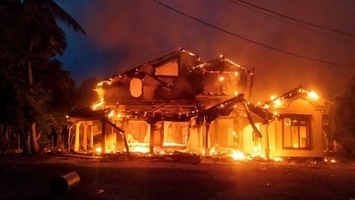 Anti-government demonstrators set fire on the house owned by minister Sanath Nishantha of resigned Prime Minister Mahinda Rajapaksa's cabinet. (REUTERS/Stringer)