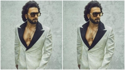 Ranveer’s suit and trousers came intricately decorated in ivory white and pastel gold prints. In a silver neck chain with a black pendant, Ranveer accessorised his look. (Instagram/@ranveersingh)