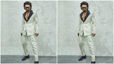 In shiny black boots, tinted shades with statement black frames and diamond ear studs, Ranveer rounded off the look for the day. (Instagram/@ranveersingh)