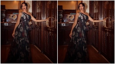 Sobhita paired a one-shoulder dramatic satin top with a pair of black trousers for the pictures. She teamed her look with classic black stilettos. (Instagram/@sobhitad)
