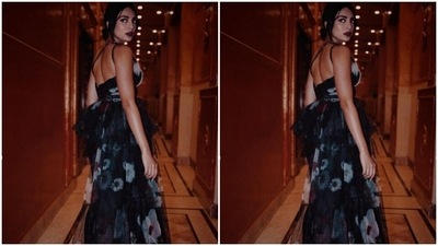 Styled by fashion stylist Siddhi H. Dolas, Sobhita wore her tresses into a bun and left a few strands of hair open around her face with a middle part. (Instagram/@sobhitad)