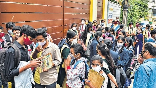 Bengaluru: Students wait outside an examination hall before appearing for the SSLC exam, (PTI File)