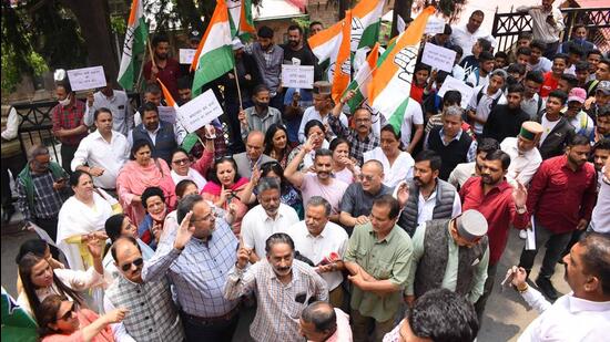Congress workers protesting against the state government on paper leak case outside the deputy commissioner's office in Shimla on Monday. (Deepak Sansta/Hindustan Times)