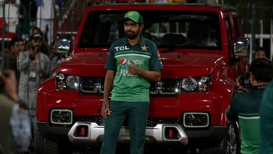 Pakistan's skipper Babar Azam poses for photograph with a vehicle he was awarded with in Lahore.(AP/File) Pakistan's skipper Babar Azam poses for photograph with a vehicle he was awarded with in Lahore.(AP/File)